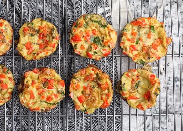 Healthy breakfast ideas and clean eating snack mini frittatas with spinach made in muffin tin
