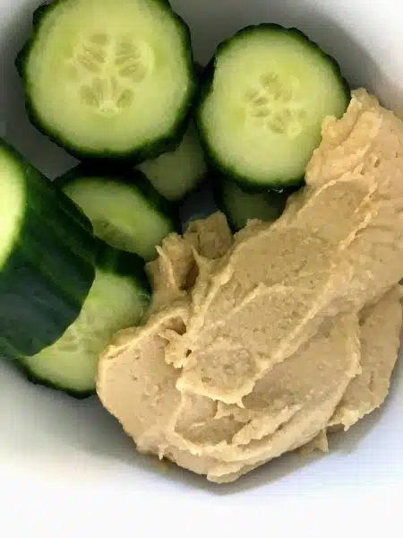sliced cucumbers and hummus