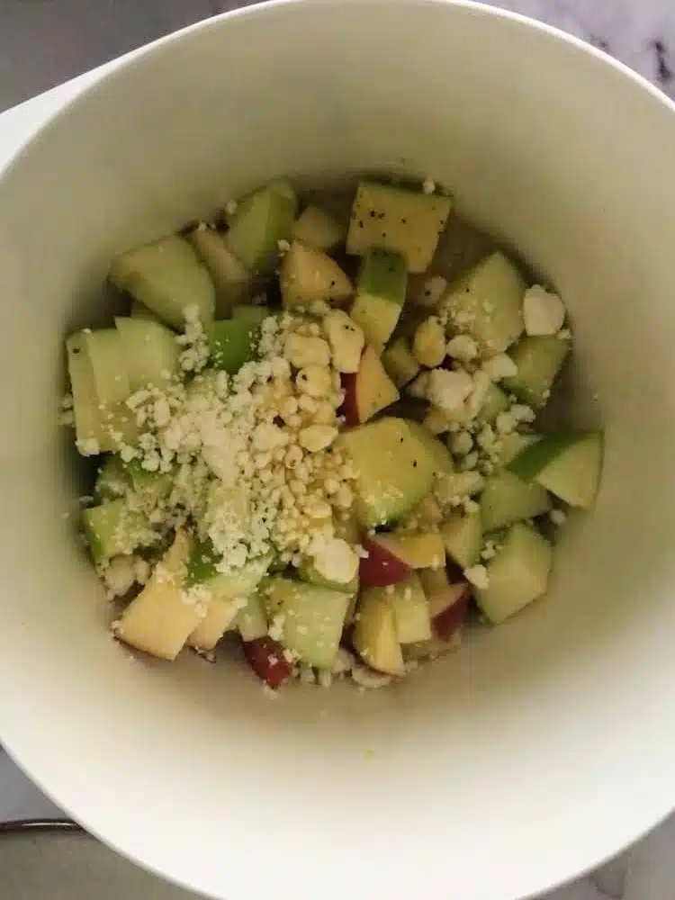 chopped apples and goat cheese in a bowl