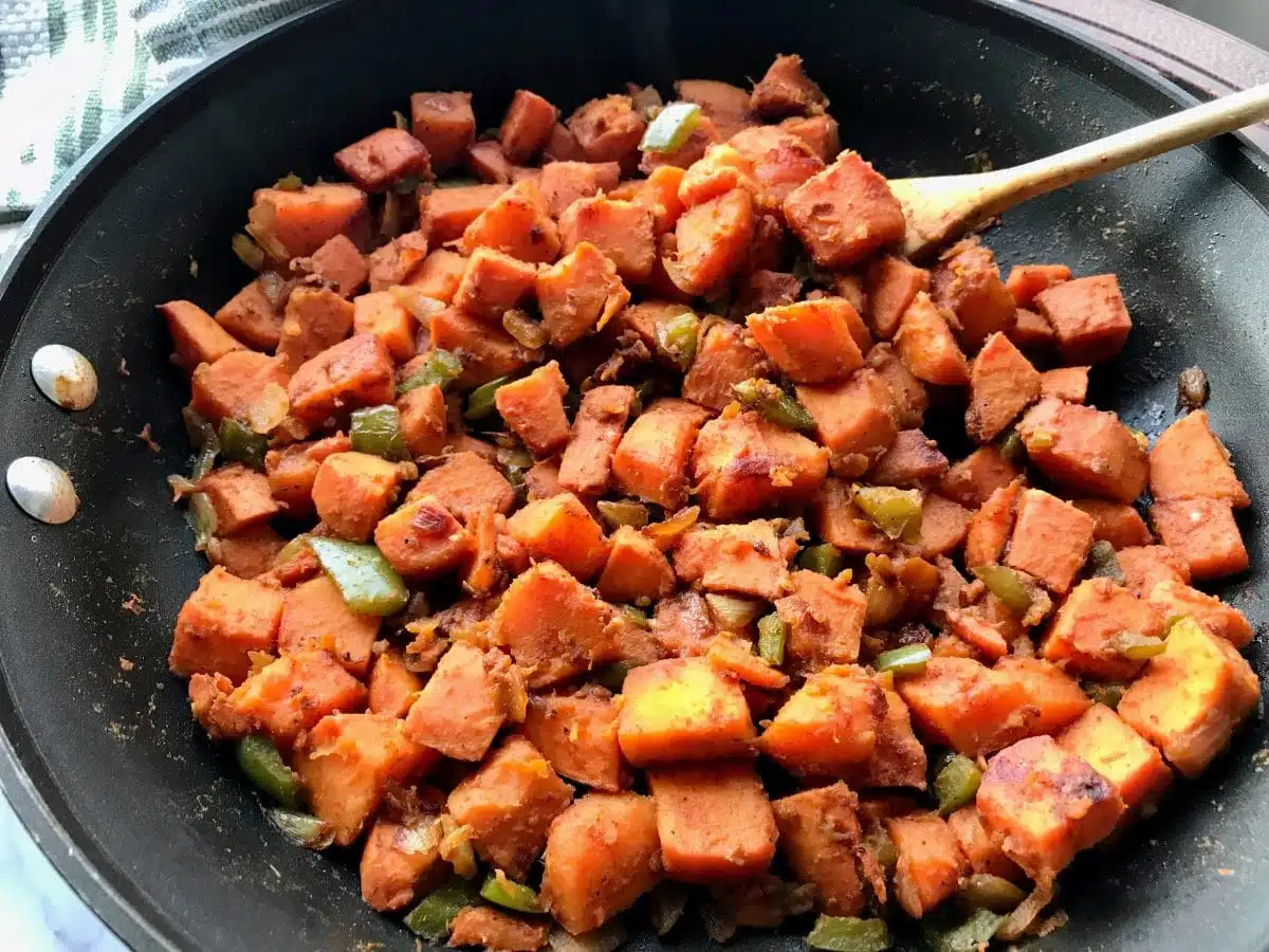 sweet potato home fries in a skillet.