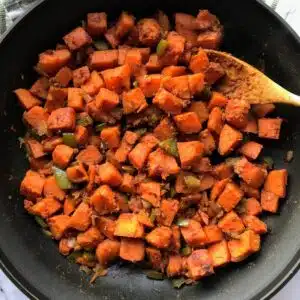 cooked sweet potatoes in a skillet.