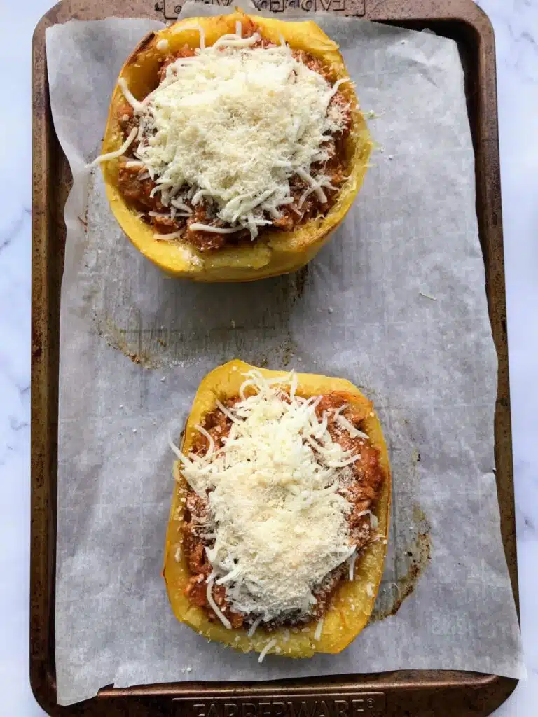 Spaghetti squash with sausage mixture and topped with mozzarella and parmesan cheese.